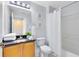 Bathroom with granite countertop and tub shower combo at 8519 Bay Lilly Loop, Kissimmee, FL 34747