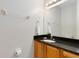 Bathroom with granite countertop and wood cabinets at 8519 Bay Lilly Loop, Kissimmee, FL 34747