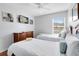 Bedroom with twin beds and a dresser at 8519 Bay Lilly Loop, Kissimmee, FL 34747