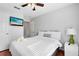 Bedroom with a TV and en-suite bathroom at 8519 Bay Lilly Loop, Kissimmee, FL 34747