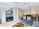 Living room with flat-screen TV and access to kitchen at 8519 Bay Lilly Loop, Kissimmee, FL 34747