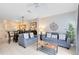 Bright living room with comfy sofas, a coffee table, and dining area at 8519 Bay Lilly Loop, Kissimmee, FL 34747