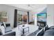 Living room with pool view and comfortable seating at 8519 Bay Lilly Loop, Kissimmee, FL 34747