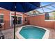 Private screened pool and patio with umbrella, grill and seating at 8519 Bay Lilly Loop, Kissimmee, FL 34747