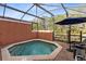 Private screened pool with patio furniture and grill at 8519 Bay Lilly Loop, Kissimmee, FL 34747