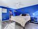 Blue bedroom with queen bed, ceiling fan and access to bathroom at 925 Wintergreen Blvd, Fern Park, FL 32730