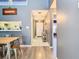Bright entryway with wood-look floors and view into the living area at 925 Wintergreen Blvd, Fern Park, FL 32730