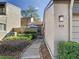Side view of townhouse entryway with gate and walkway at 925 Wintergreen Blvd, Fern Park, FL 32730
