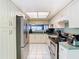 Updated kitchen, stainless steel appliances, and white cabinets at 925 Wintergreen Blvd, Fern Park, FL 32730