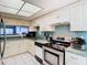Modern kitchen featuring stainless steel appliances and white cabinetry at 925 Wintergreen Blvd, Fern Park, FL 32730