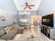 Open concept living area with L-shaped sectional and dining area at 925 Wintergreen Blvd, Fern Park, FL 32730
