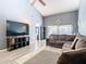 Spacious living room with L-shaped sectional sofa and access to the patio at 925 Wintergreen Blvd, Fern Park, FL 32730