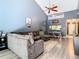 Open living room and dining area with vaulted ceiling and L-shaped sofa at 925 Wintergreen Blvd, Fern Park, FL 32730