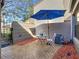 Small patio area with table, chairs, and umbrella at 925 Wintergreen Blvd, Fern Park, FL 32730