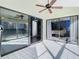 Sunroom with tiled floors, sliding glass doors, and access to bedroom at 925 Wintergreen Blvd, Fern Park, FL 32730