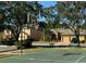 Community basketball court with goals and surrounding homes at 9714 Nonacrest Dr, Orlando, FL 32832
