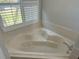 Relax in this large corner bathtub at 9714 Nonacrest Dr, Orlando, FL 32832