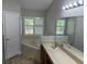 Bathroom with double vanity and corner tub at 9714 Nonacrest Dr, Orlando, FL 32832