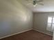 Bedroom with neutral walls, carpet flooring and a window with shutters at 9714 Nonacrest Dr, Orlando, FL 32832