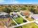 Aerial view of a home with a screened-in pool and manicured lawn at 1101 Maidenmoor Rd, Winter Garden, FL 34787