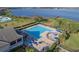 Aerial view of Stoneybrook's large Community Pool and lake views at 1101 Maidenmoor Rd, Winter Garden, FL 34787