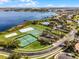 Aerial view of community amenities including pool, tennis, playground, and lake access at 1101 Maidenmoor Rd, Winter Garden, FL 34787