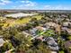A high aerial view of a community featuring a home with a backyard trampoline and pool at 1101 Maidenmoor Rd, Winter Garden, FL 34787