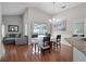 Inviting dining area with hardwood floors, neutral walls, and a view of the screened lanai at 1101 Maidenmoor Rd, Winter Garden, FL 34787