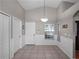 Bright kitchen area boasts tile floors and access to both the front door and the dining area at 1101 Maidenmoor Rd, Winter Garden, FL 34787