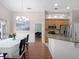 A view of the kitchen and dining area features stainless steel appliances and access to outdoor lanai at 1101 Maidenmoor Rd, Winter Garden, FL 34787