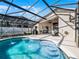 Inviting outdoor patio with a screened pool, perfect for entertaining with a grill and dining set at 1101 Maidenmoor Rd, Winter Garden, FL 34787
