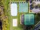 Overhead aerial view of sports facilities featuring tennis, volleyball, hockey, and basketball courts at 1101 Maidenmoor Rd, Winter Garden, FL 34787