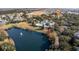 Aerial view showing the community, lake, and clubhouse at 114 Rum Run, Davenport, FL 33837