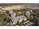 Aerial view of community with pool, buildings, and ample parking at 114 Rum Run, Davenport, FL 33837