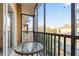 Screened balcony with a small table and chairs, offering a relaxing outdoor space at 114 Rum Run, Davenport, FL 33837