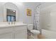 Clean bathroom with a bathtub and updated vanity at 114 Rum Run, Davenport, FL 33837