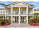 Community clubhouse with columns and a balcony at 114 Rum Run, Davenport, FL 33837