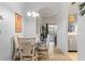 Bright dining room with glass-top table and seating for six at 114 Rum Run, Davenport, FL 33837