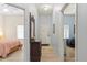 Bright entryway with view of two bedrooms and a charming mirror at 114 Rum Run, Davenport, FL 33837