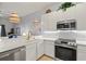 Kitchen with stainless steel appliances and a breakfast bar at 114 Rum Run, Davenport, FL 33837