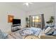 Living area with access to balcony and plenty of natural light at 114 Rum Run, Davenport, FL 33837