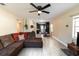 Open concept living area showcasing a sectional sofa and kitchen view at 1232 Saint James Rd, Orlando, FL 32808