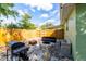 Cozy patio with firepit, grill, and seating area at 1232 Saint James Rd, Orlando, FL 32808