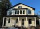 Two-story Craftsman home with white siding, black trim, and a front porch at 1317 Weber St, Orlando, FL 32803