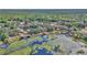 Aerial view of lush lake and trees surrounding lakeside properties at 15040 Ne 248Th Avenue Rd, Fort Mc Coy, FL 32134