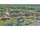 Aerial view of a waterfront cottage with a boat dock, surrounded by lush greenery and serene waters at 15040 Ne 248Th Avenue Rd, Fort Mc Coy, FL 32134