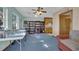 Bright bonus room with built-in bookshelves, craft area, and large windows for ample natural light at 15040 Ne 248Th Avenue Rd, Fort Mc Coy, FL 32134