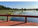 Waterfront view from the dock showcasing lily pads and mature trees at 15040 Ne 248Th Avenue Rd, Fort Mc Coy, FL 32134