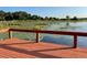 Stunning lake view from private wooden dock overlooking lily pads at 15040 Ne 248Th Avenue Rd, Fort Mc Coy, FL 32134