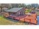 Charming waterfront cabin with a large deck for entertaining and relaxing by the water at 15040 Ne 248Th Avenue Rd, Fort Mc Coy, FL 32134